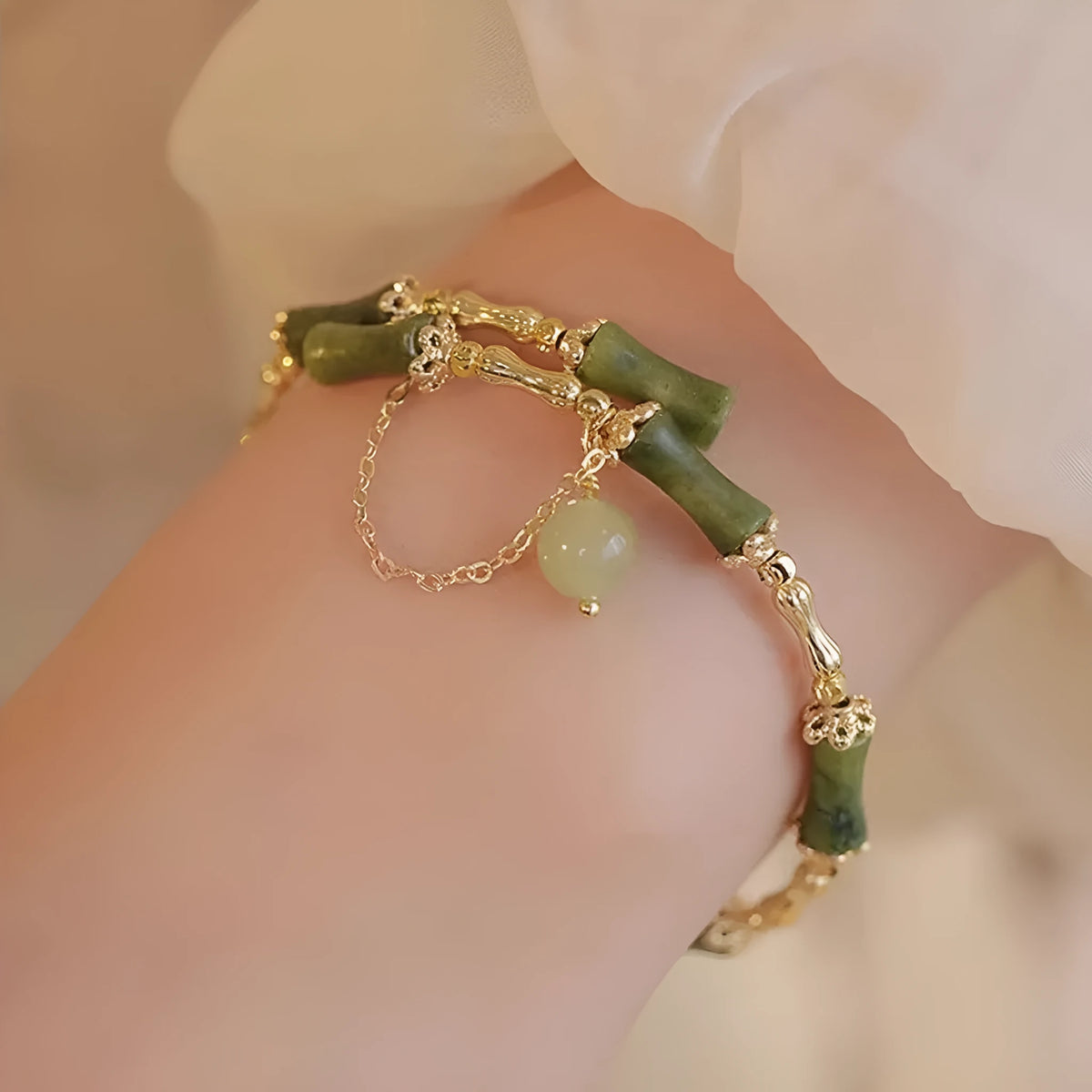 Women's bamboo bracelet with coloured glaze beads in plum wine colour featuring bamboo joint design