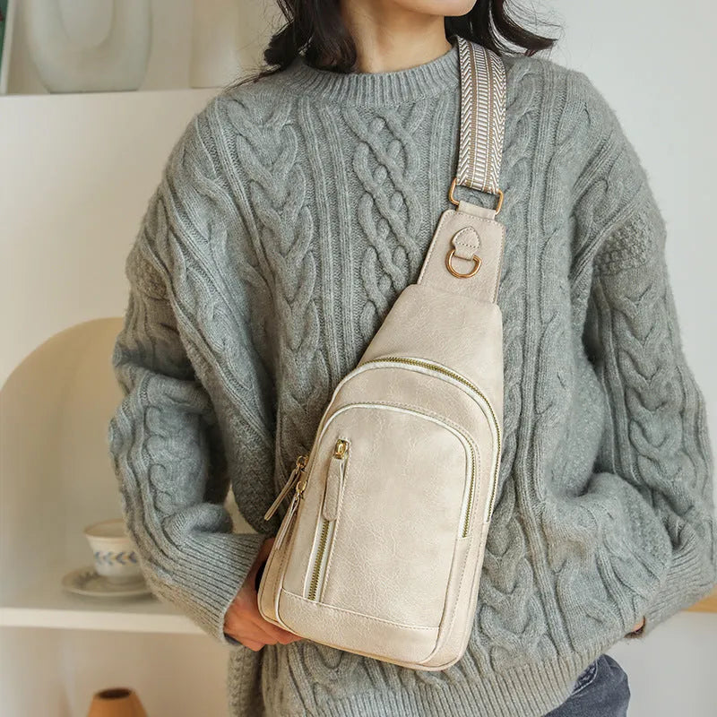 Women's soft PU chest bag in street trend style with zipper pockets and sewing thread details
