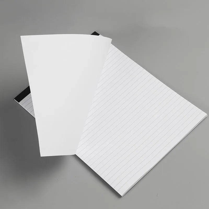 A4 tearable notebook with grid-lined pages and paper cover, showing adhesive binding.