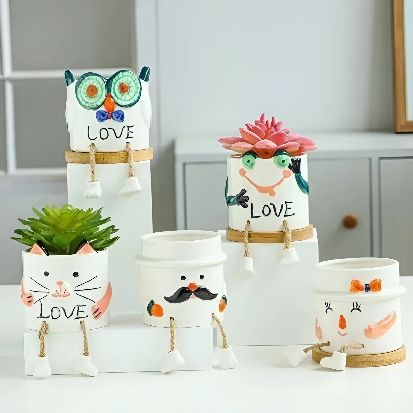 Ceramic hanging foot flowerpot for succulent plants in cartoon style with twelve colour variations on desktop