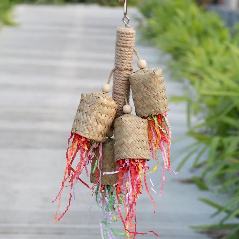 Parrot toy with wood and sisal construction containing colourful shredded paper, 15cm by 35cm