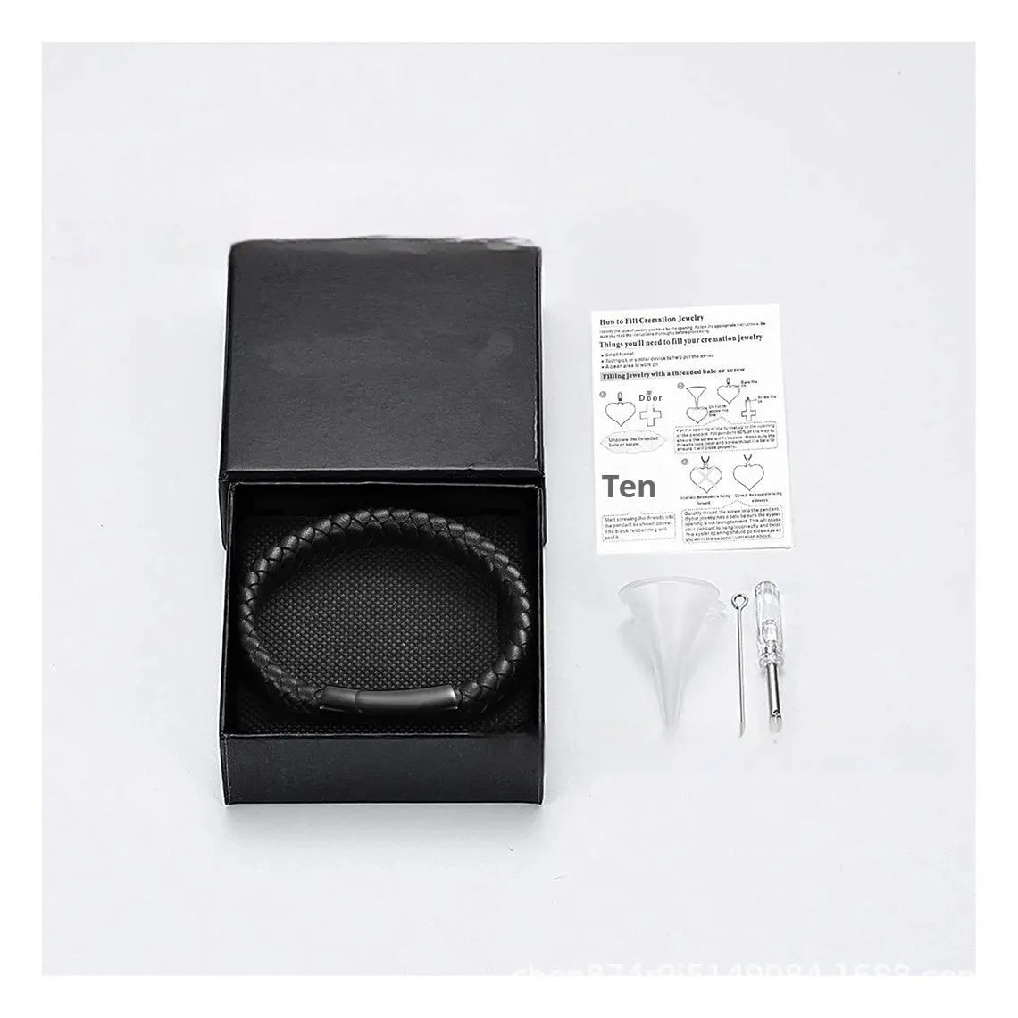Black stainless steel bracelet with leather cinerary charm and engraved text, presented in a gift box.