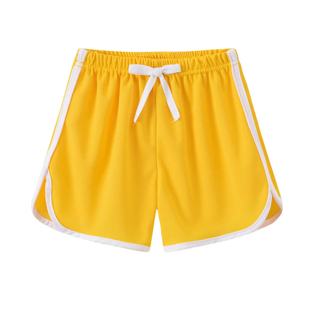 Children's colourful polyester beach shorts showing patterns like leopard print, stripes, and pineapples.