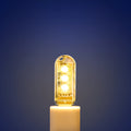 Small white LED night light showing warm and cool light options with USB charging port