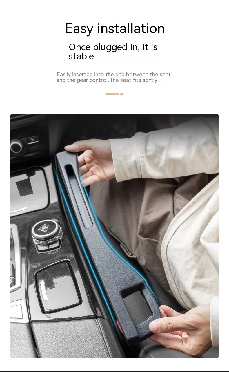 Black plastic car seat gap storage pocket with handle placed between vehicle seats.
