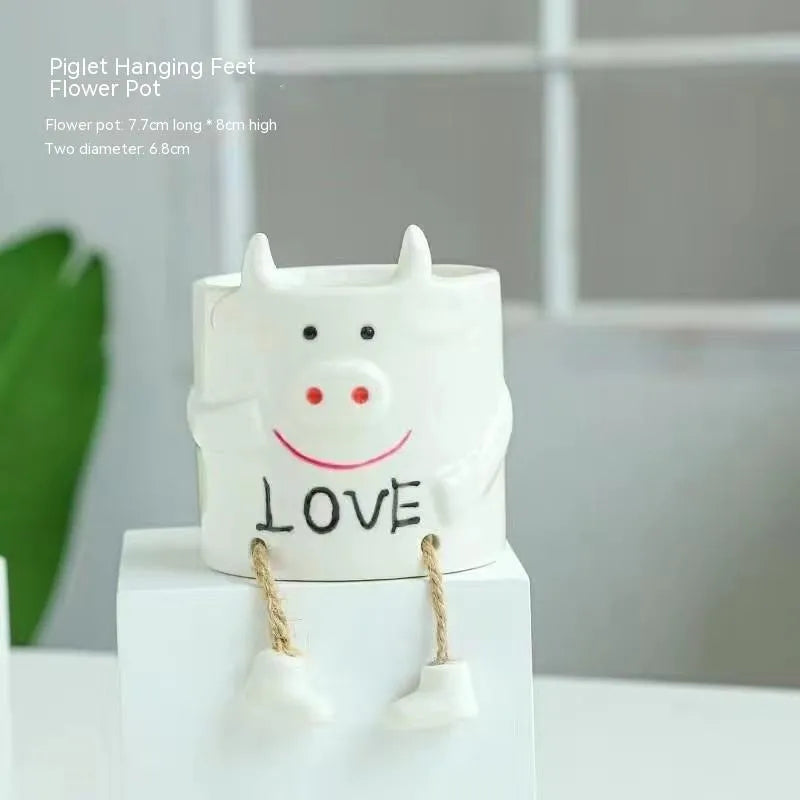Ceramic hanging foot flowerpot for succulent plants in cartoon style with twelve colour variations on desktop