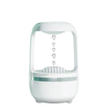 White anti-gravity humidifier showing water droplet backflow effect with USB cable connection