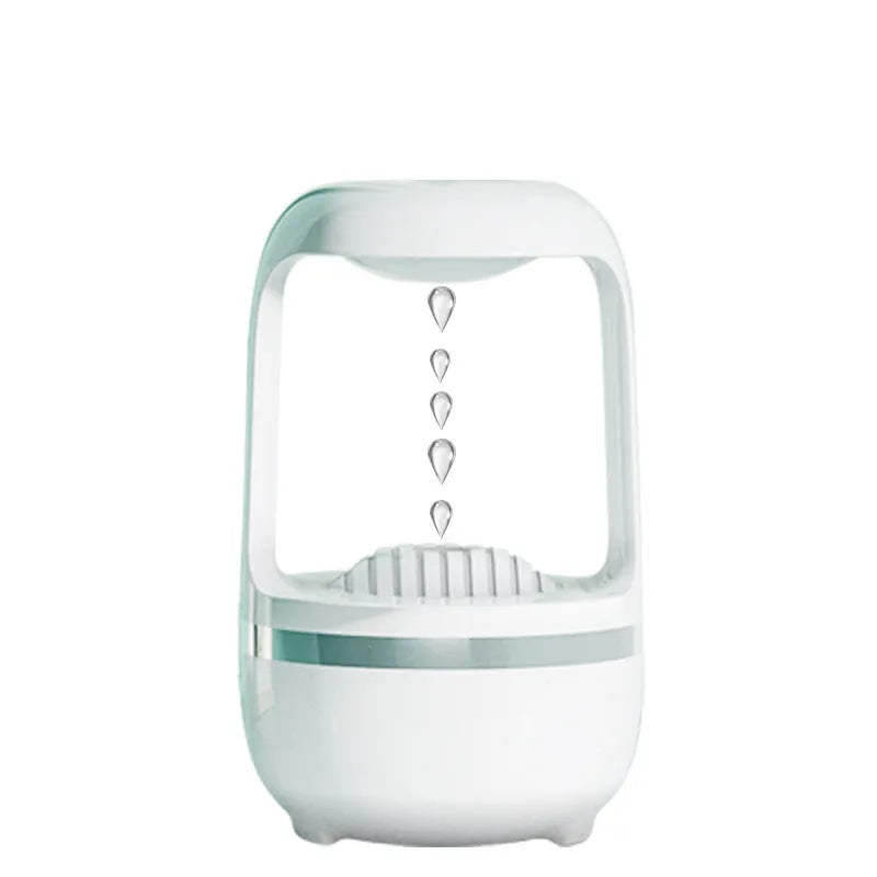 White anti-gravity humidifier showing water droplet backflow effect with USB cable connection