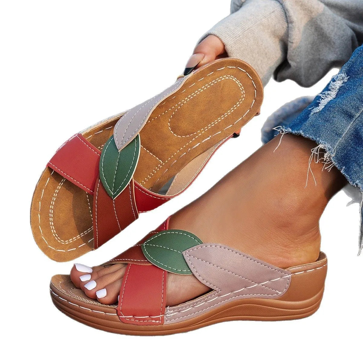 Women's black peep-toe slipper with a cross-strap and thick sole on a white background.