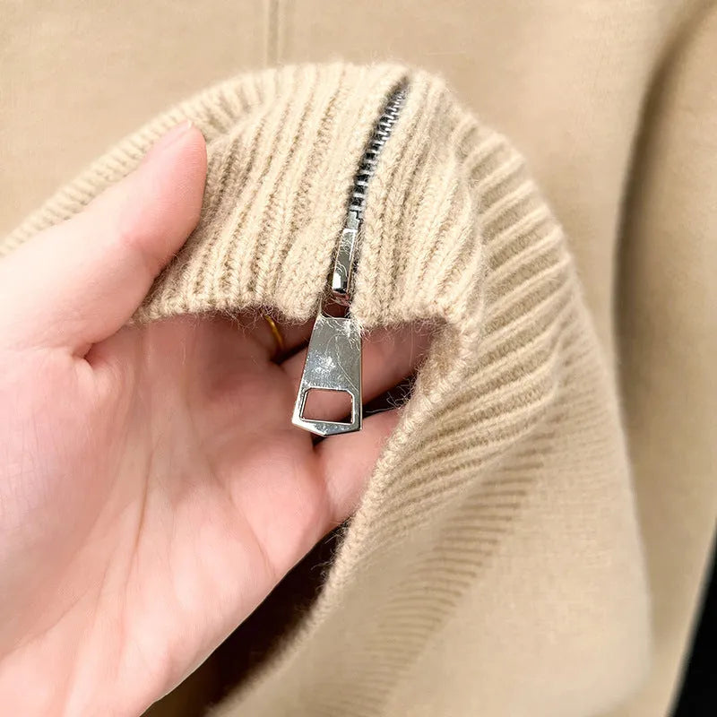 Man wearing a beige stand collar zip-front knitted cardigan with a loose fit.