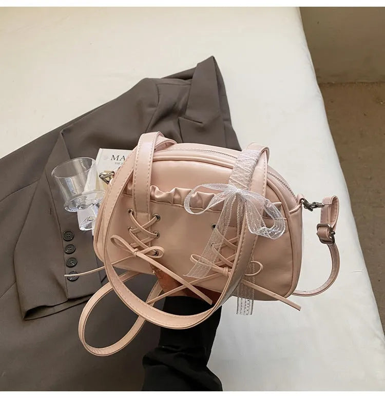 Ladies casual shoulder bag with bandage bow detail and internal mobile phone compartment