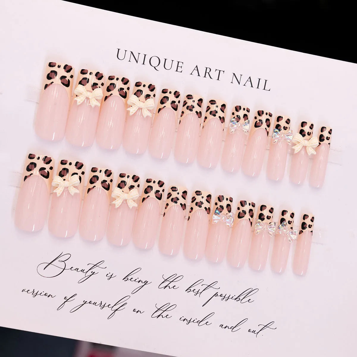 Leopard print butterfly design plastic nail art decorations set on a white background