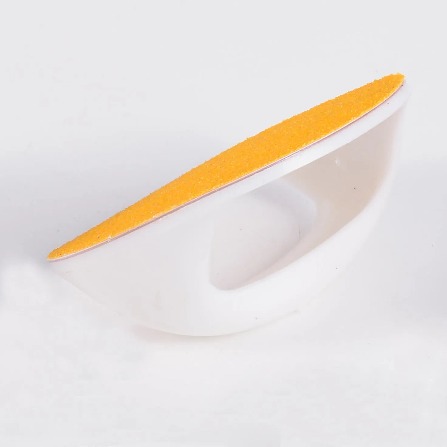Square blue dog nail file scratch board with ergonomic handle on a white background.