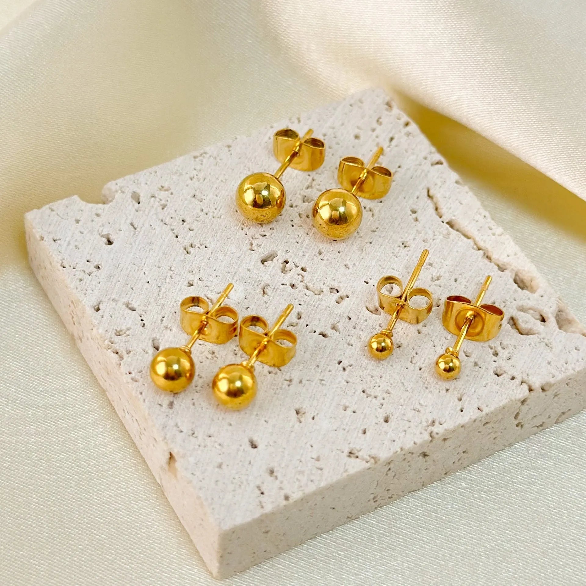 Minimalist 18K gold plated titanium steel ball stud earrings in 3mm, 4mm, 5mm, and 6mm sizes for women.