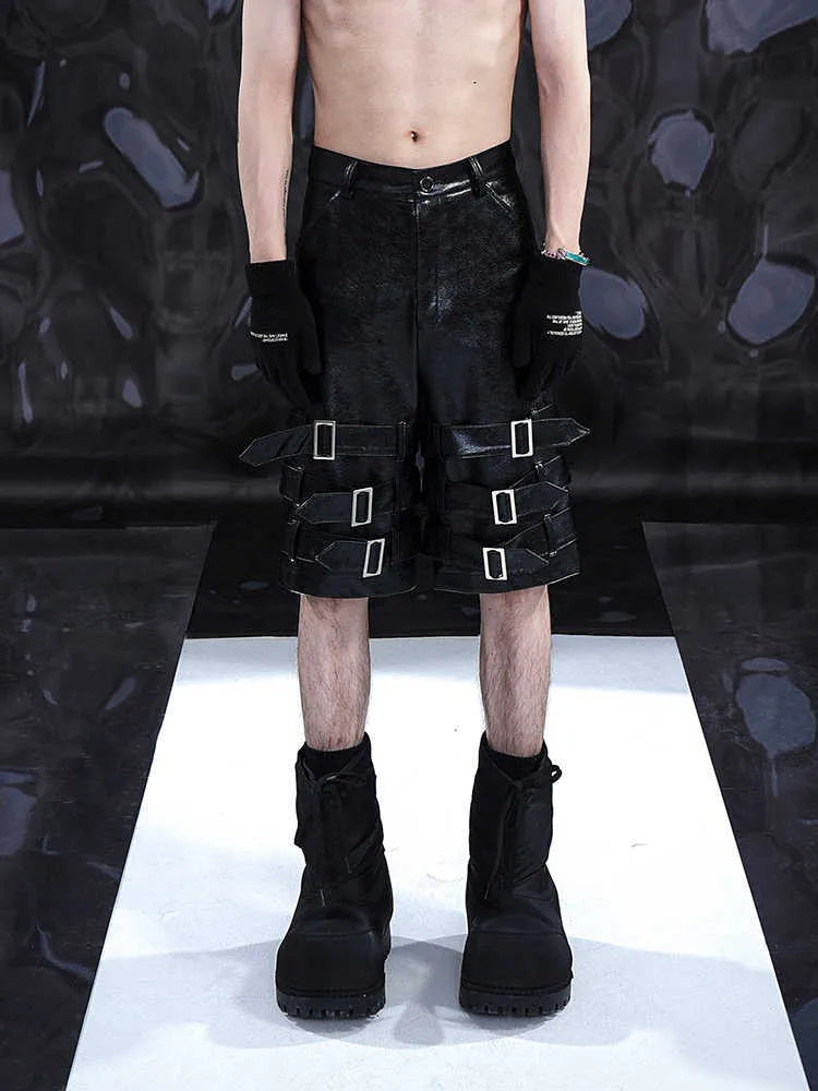 Men's black PU leather cropped pants showing mid to low waist design and flexible polycarbaminate construction