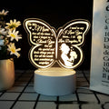 A white heart-shaped table lamp with a touch-sensitive base and a USB cable.