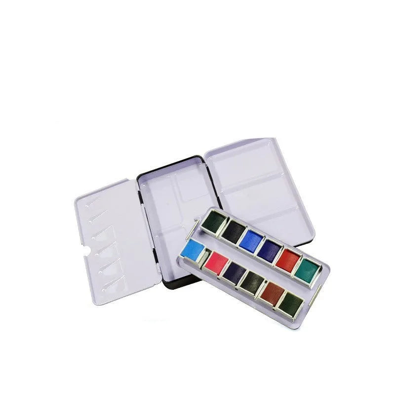 Tinplate metal watercolour paint box with folding compartments for solid pigment storage