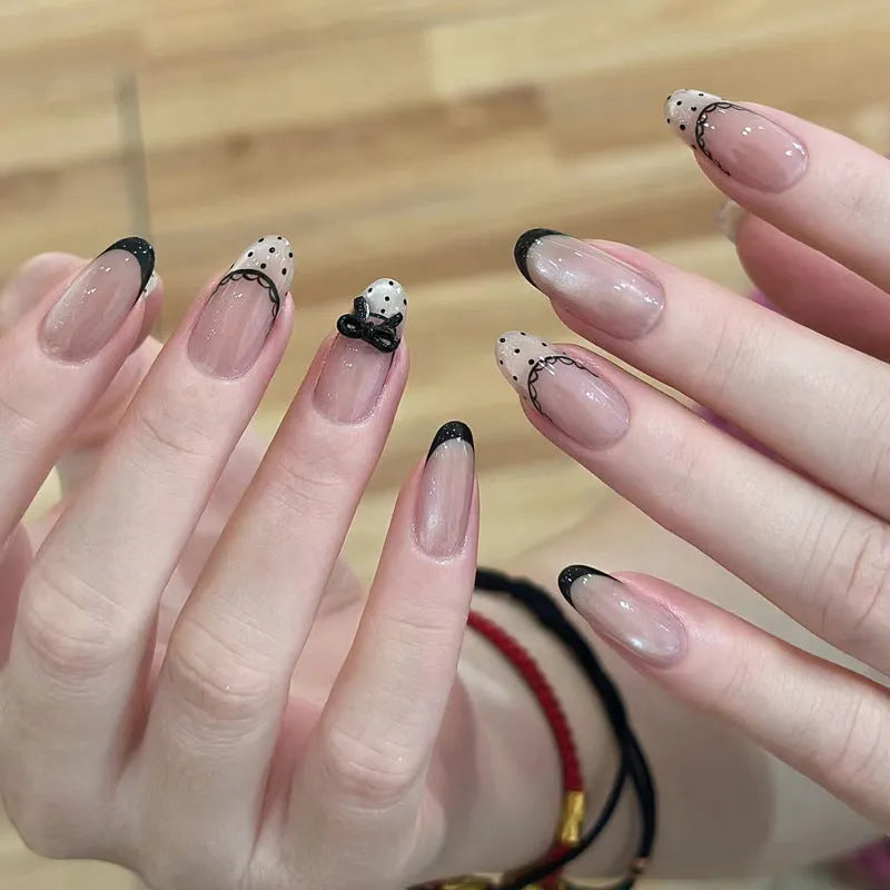 Five sets of short square shaped press-on fake nails with a peel-and-stick backing, shown in assorted colours.