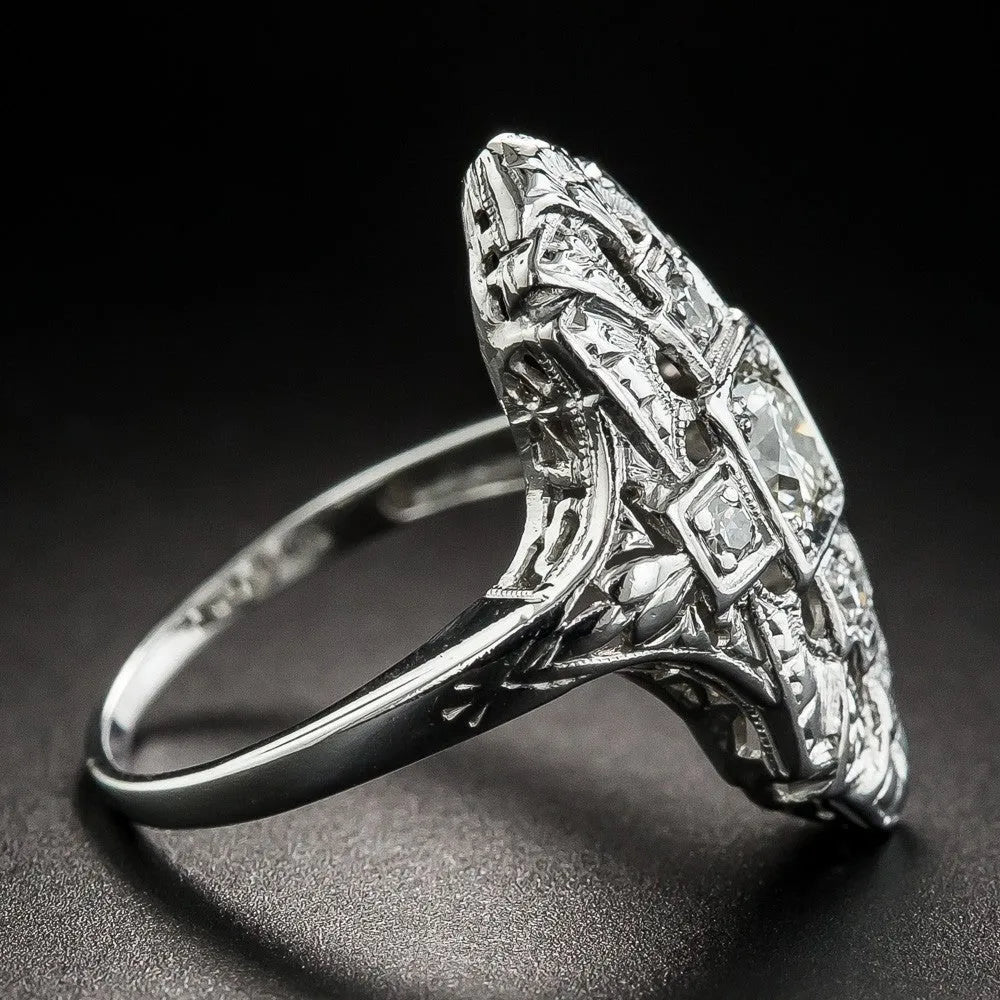 Hollow geometric silver-coloured ring with diamond-studded cubic zirconia stones, shown in profile view