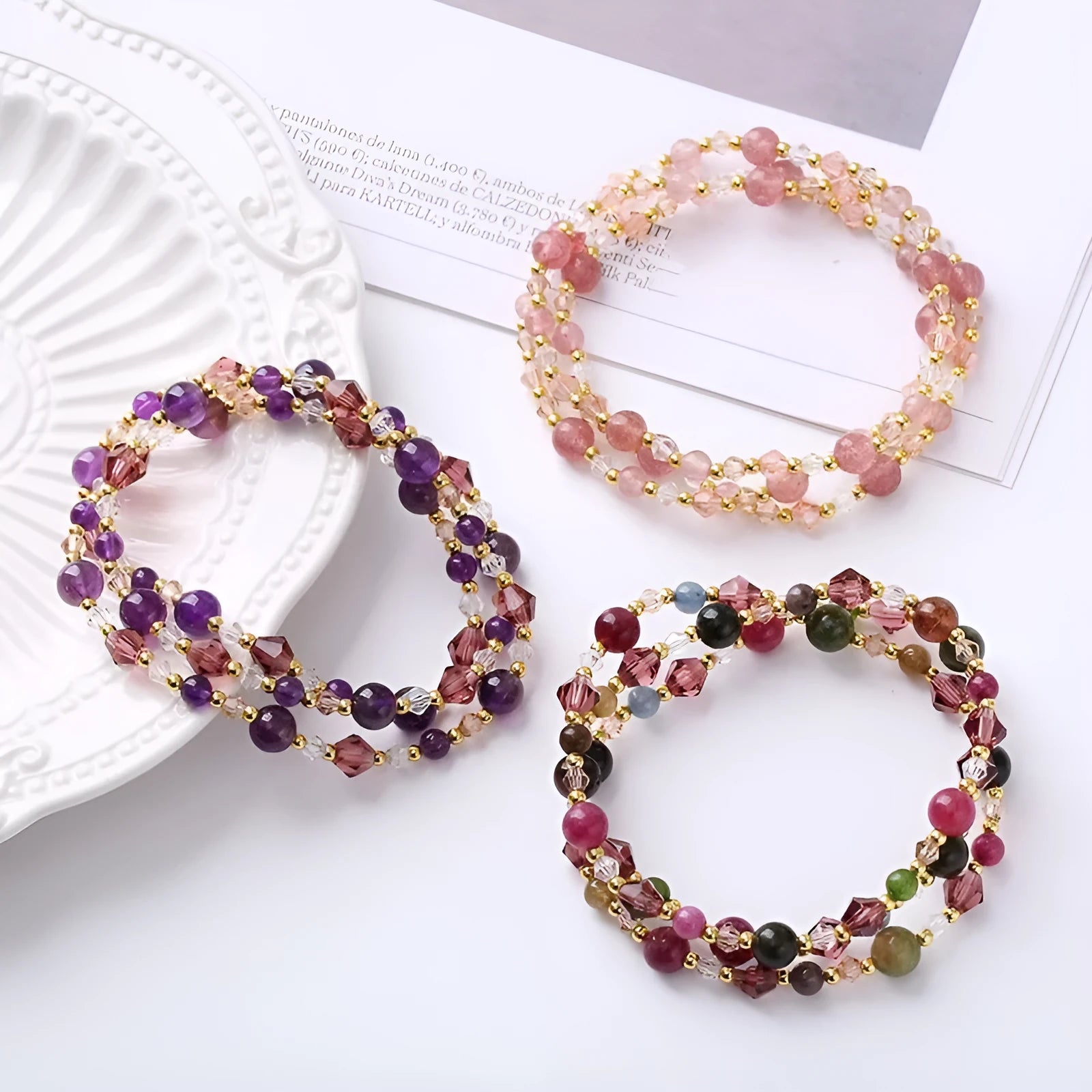 Women's adjustable crystal bracelet with three-ring beads on a cord in tourmaline, strawberry quartz, or amethyst