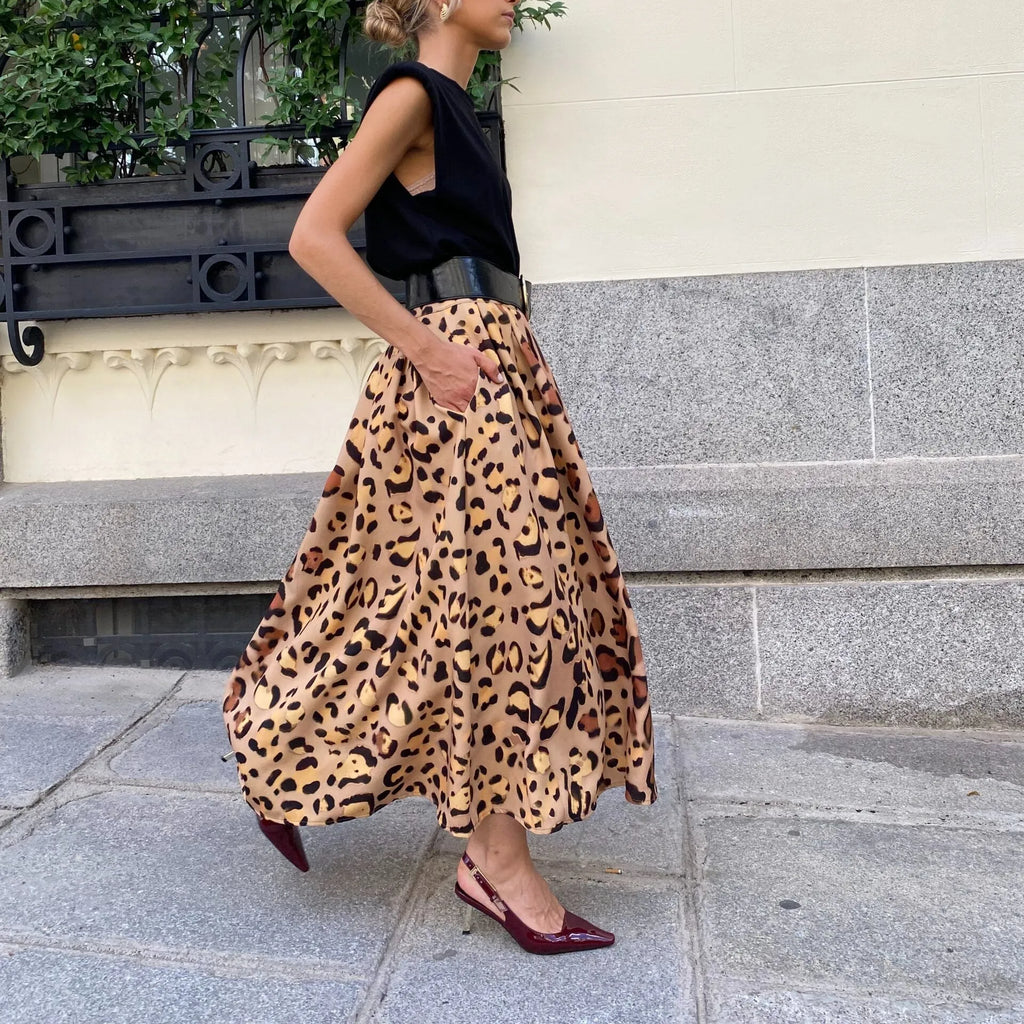 Brown leopard print women's A-line long skirt with a big hem, laid flat.