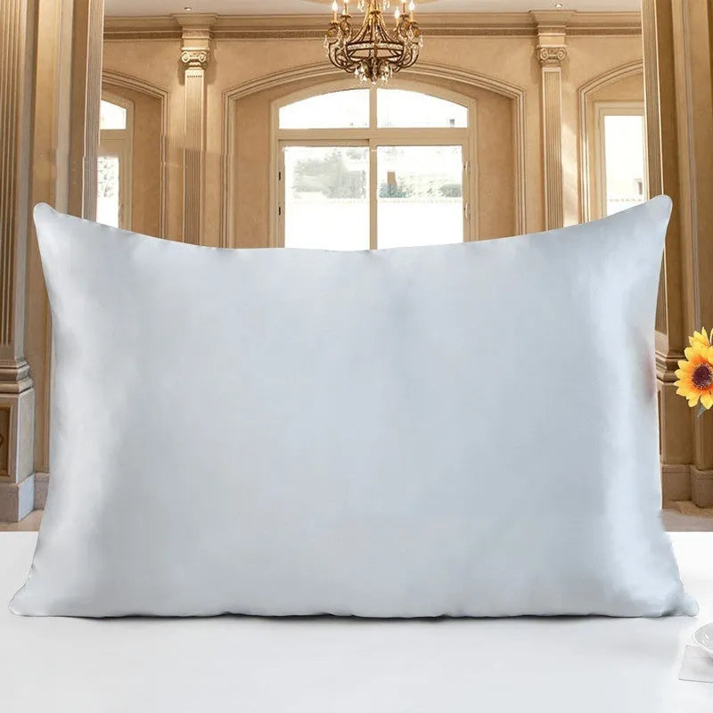 19 M double-sided silk pillowcase shown in apricot colour, lying flat to show envelope closure.