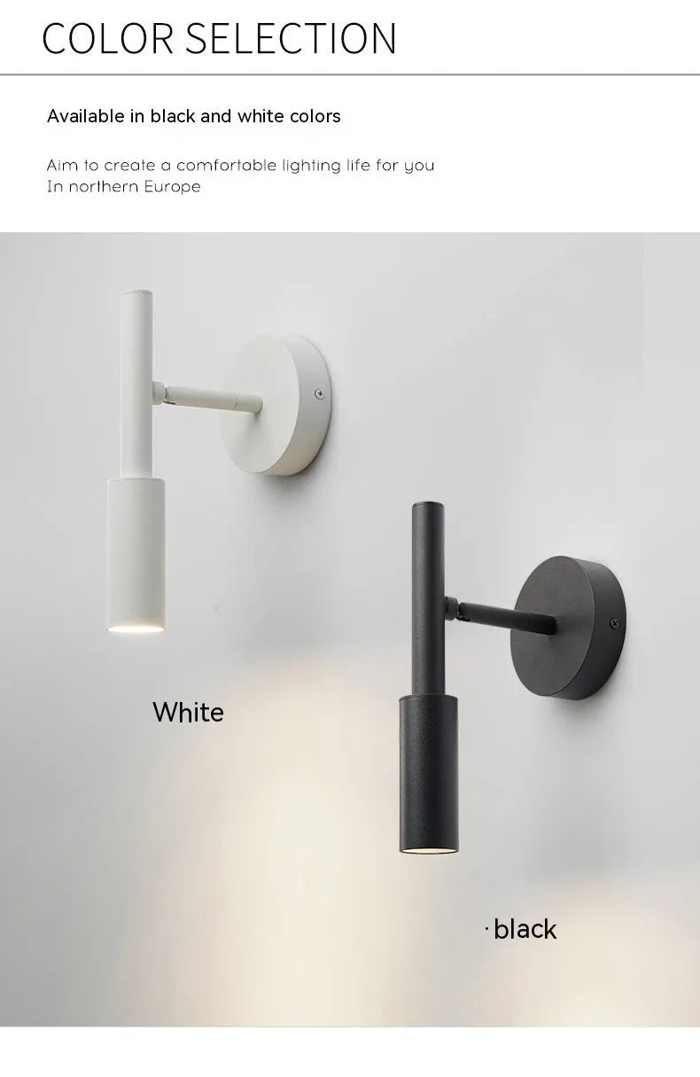 Modern cylindrical wrought iron wall lamp in black or white with three colour light settings.