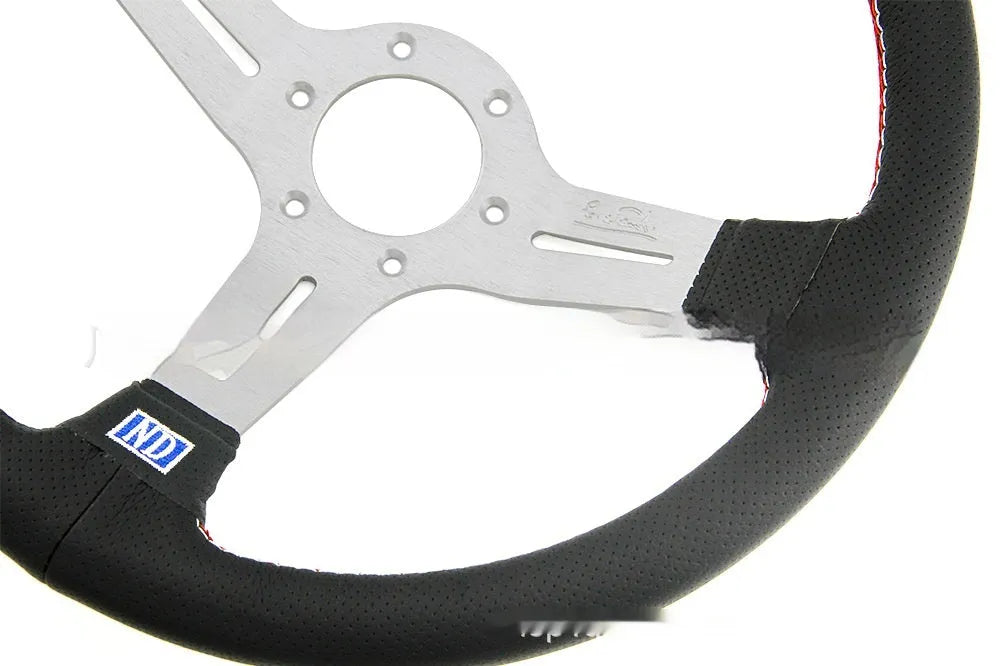 Leather 14-inch steering wheel with a concave centre, shown with black and silver skeleton frame options.