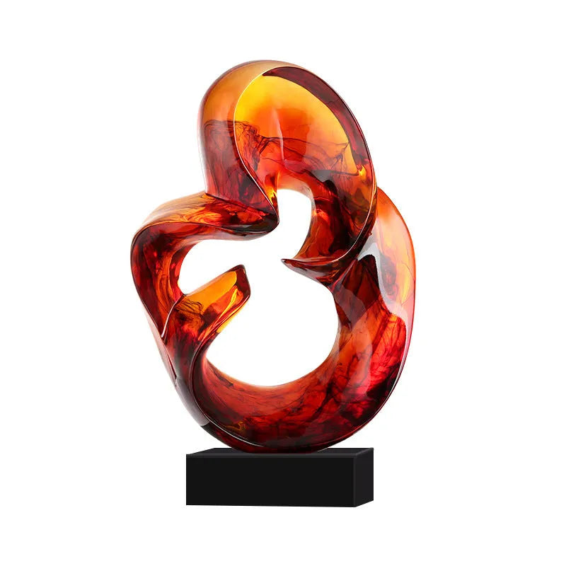 Clear transparent resin sculpture ornament in modern style on a shelf, shown in blue and orange red colour options.