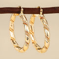 Geometric copper women's earrings with ring ear clip design in golden colour
