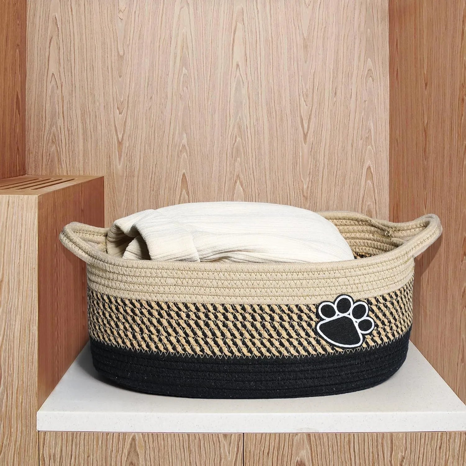 Light beige handmade cotton rope storage basket with handle for nursery toys and home organisation
