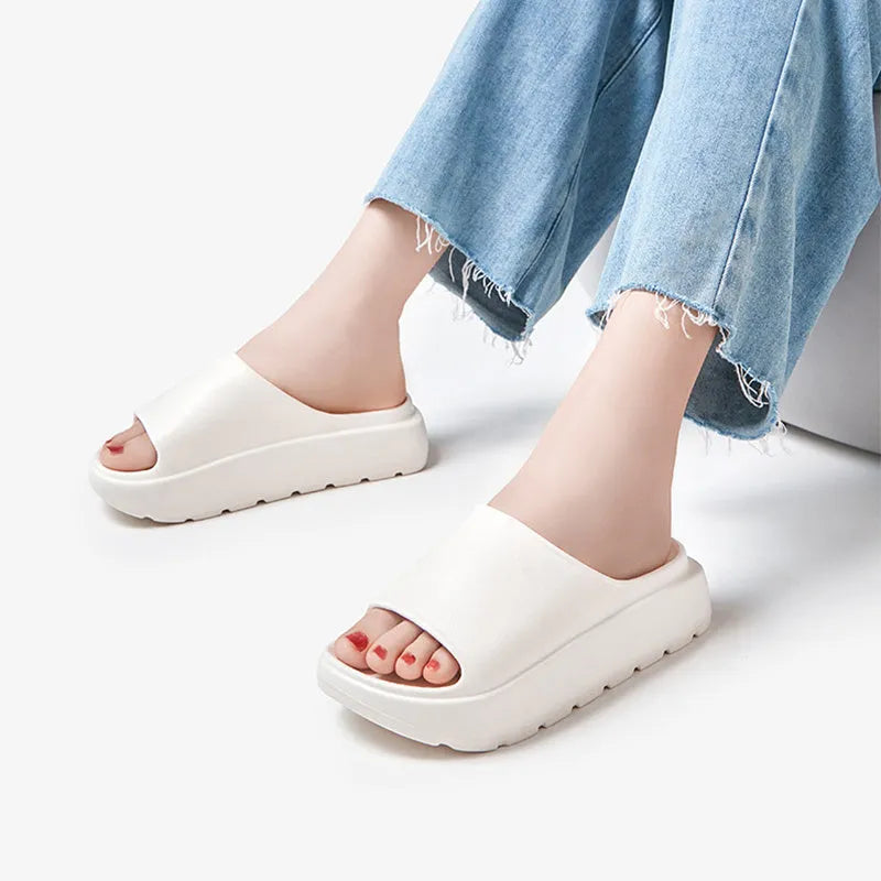 Women's beige fish mouth design EVA foam slippers with a thick 5.5cm sole.
