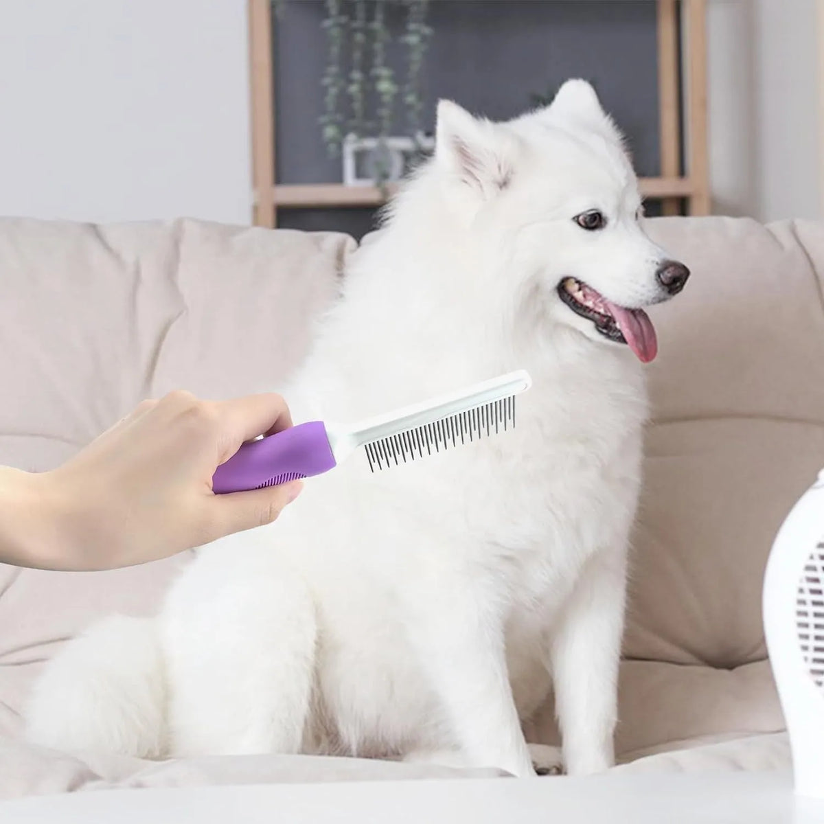 Purple pet detangling comb with stainless steel long and short teeth on a white background