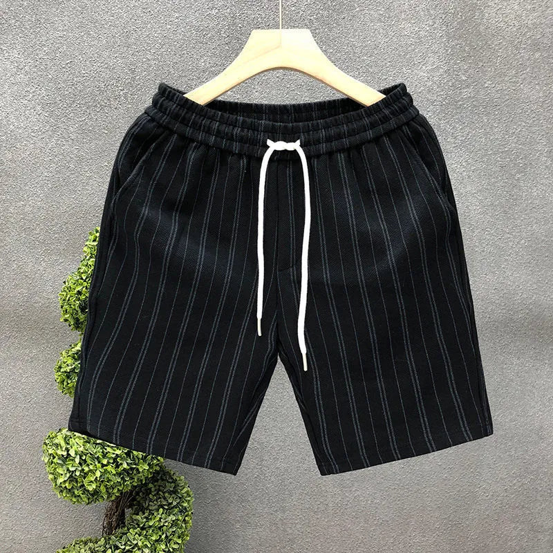 Men's black and white striped fleece-lined casual shorts with an ankle band and double waistband.