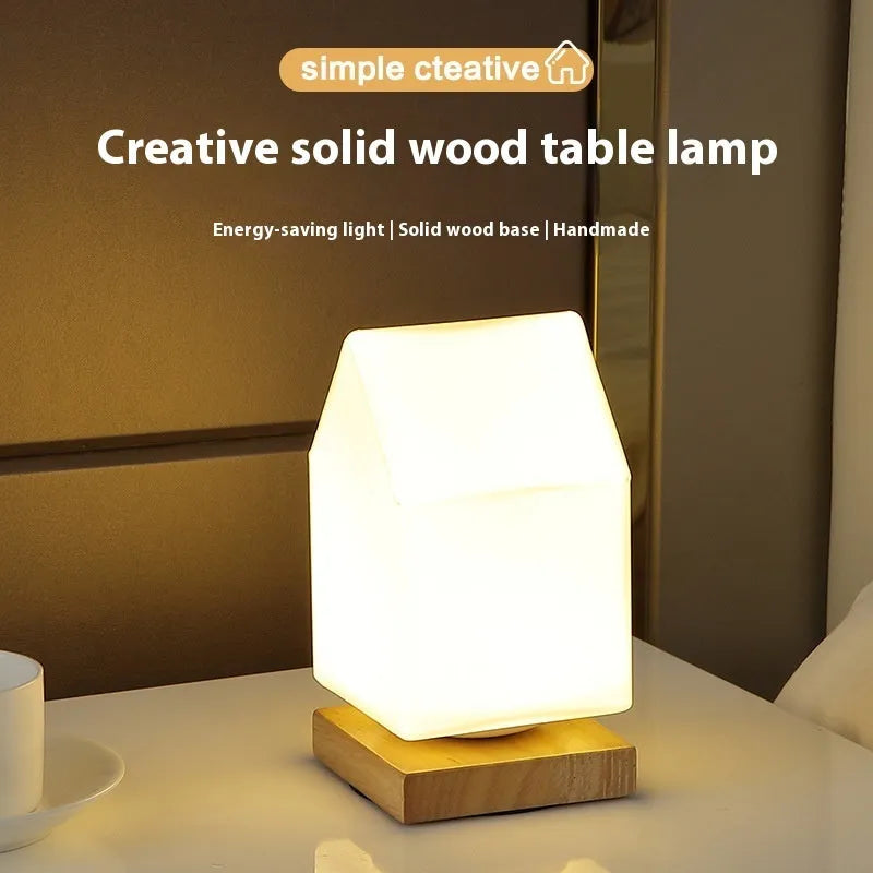 Nordic solid wood flower-shaped USB table lamp with touch dimming in a white cube style on a table