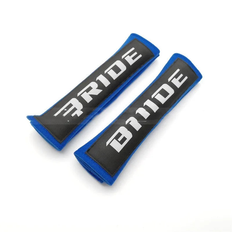 Pair of black car seat belt shoulder pad sleeves with embroidery detail, showing dimensions.