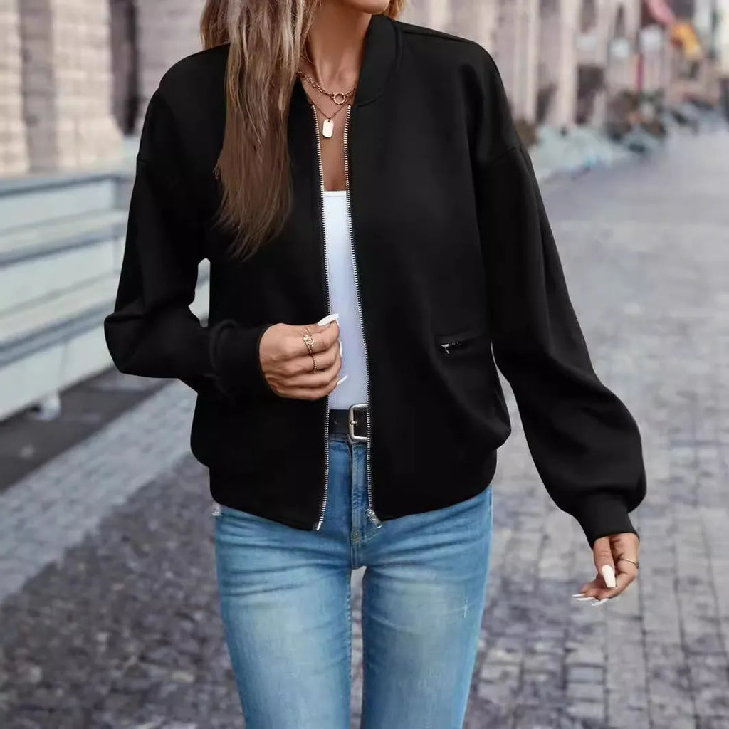 Black women's casual zip jacket with long sleeves on a hanger
