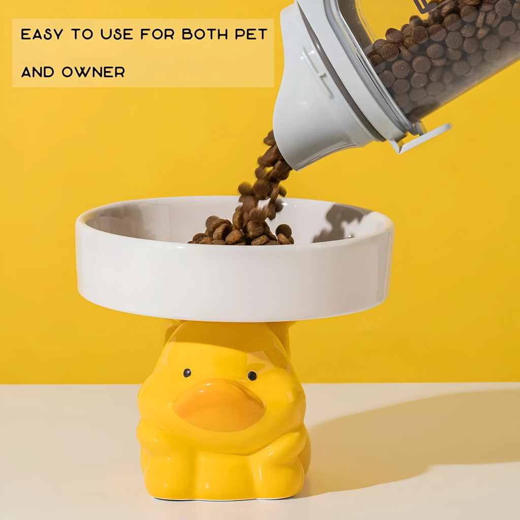 Raised ceramic cat bowl with cute animal design in pink, yellow, or white on a white background