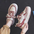 Low top rubber sneaker in pink or milky white with height increasing sole and breathable design