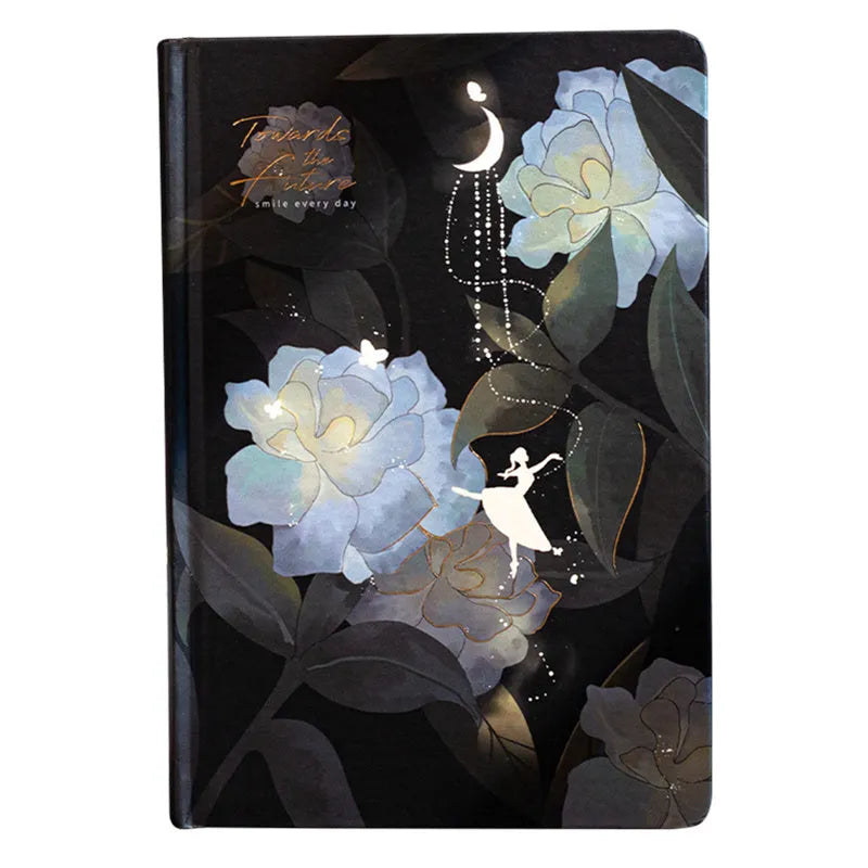 A5 notebook with luminous holographic cover lying flat, showing colourful illustrated interior pages.