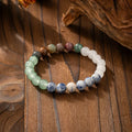 Vintage style long beaded necklace with geometric stone beads and matching bracelet in antique-inspired colours