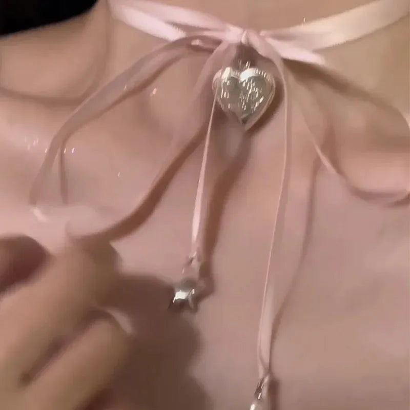 Women's gold-colour ribbon love pendant necklace on slender clavicle chain