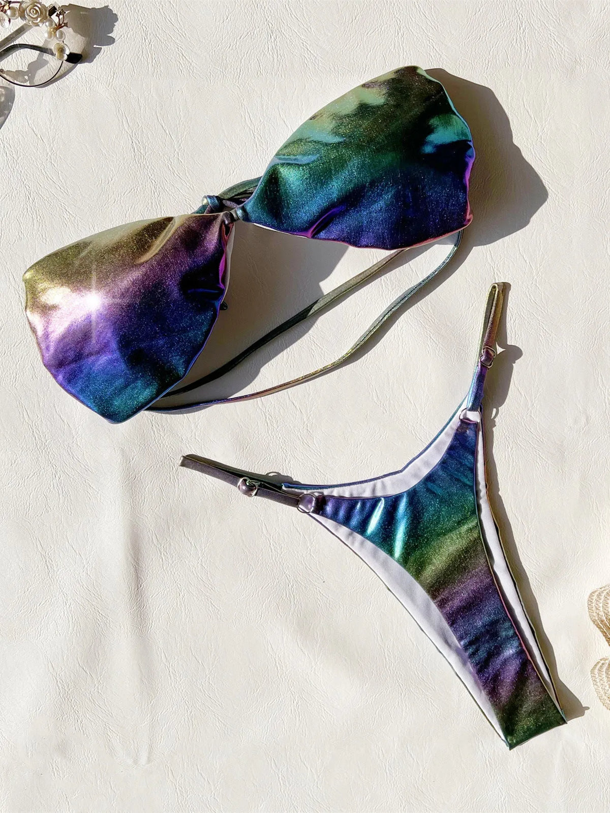 Women's purple gradient two-piece bikini swimsuit made from polyester fabric.