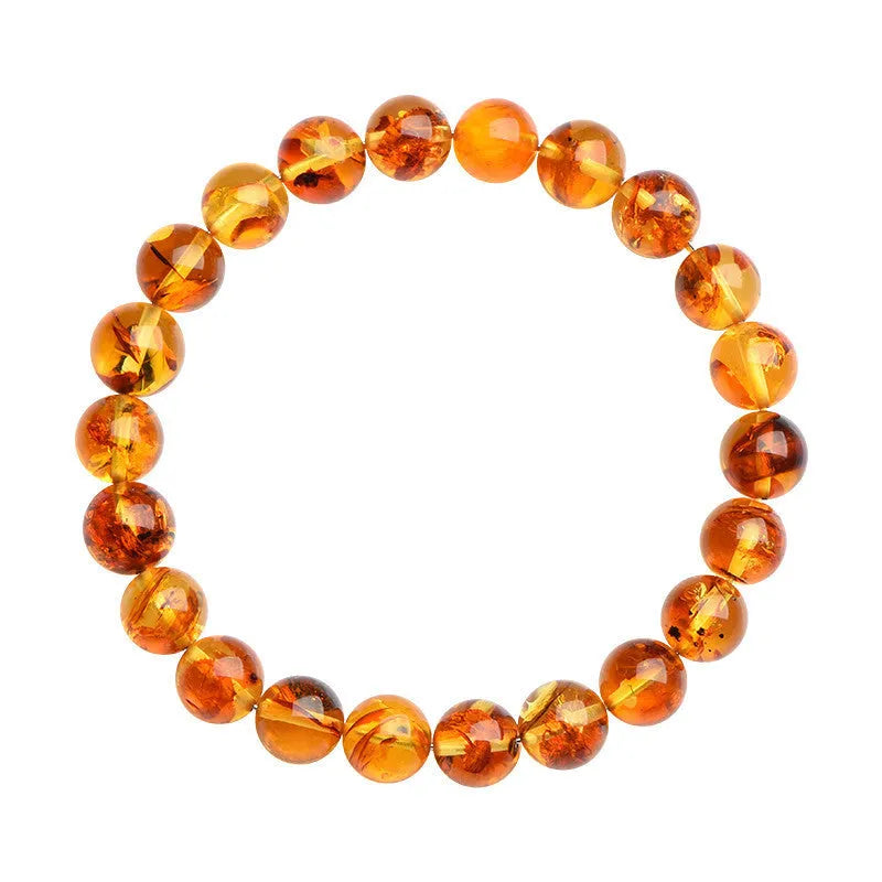 Natural yellow piebald amber bracelet with geometric beads in polished finish