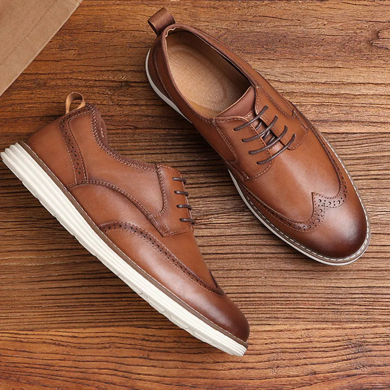 Men's black and brown slip-on business casual shoes with round toe and carved detailing