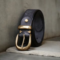 Men's black casual leather belt with copper pin buckle on a white background