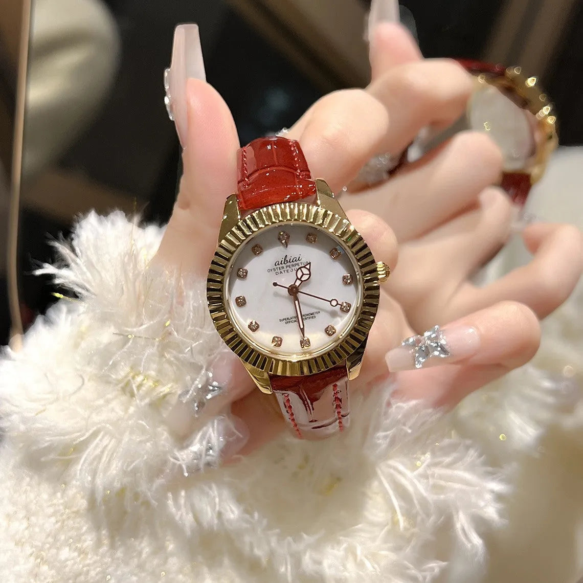 Women's rose shell dial watch with 7mm slim case, shown with leather or steel strap options