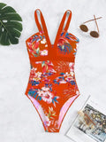 Women's floral patterned backless one-piece swimsuit on a mannequin.