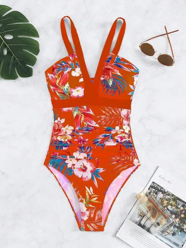 Women's floral patterned backless one-piece swimsuit on a mannequin.