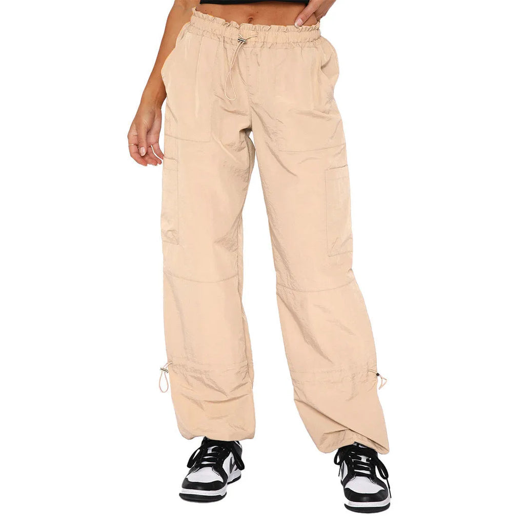 Man wearing loose-fit khaki coloured cargo pants with multiple pockets, straight leg design.